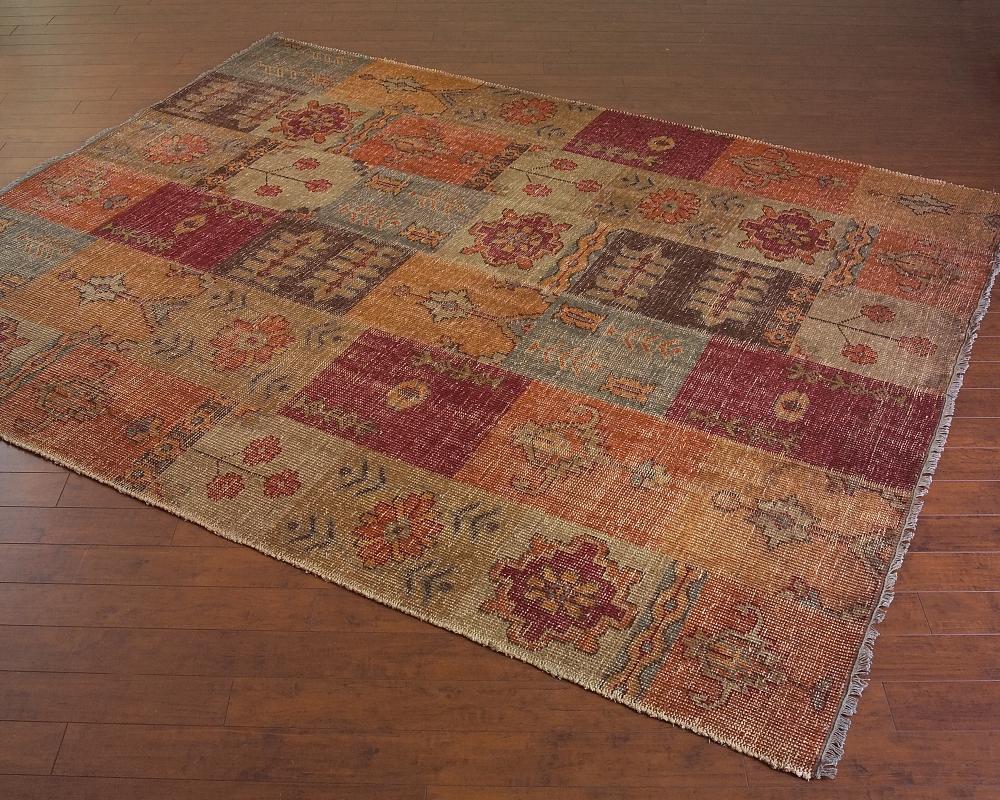HAND WOVEN JEWELTONE PATCHWORK RUG WOULD ADD WARMTH TO ANY ROOM.  INDIGO, CAMEL AND BURGUNDY ARE A B